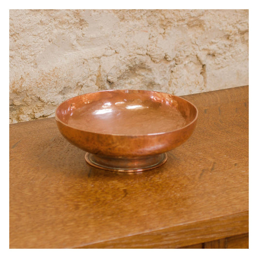 An Arts & Crafts Lakes School hand beaten copper bowl by Fanny Carter