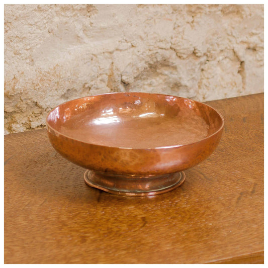 An Arts & Crafts Lakes School hand beaten copper bowl by Fanny Carter