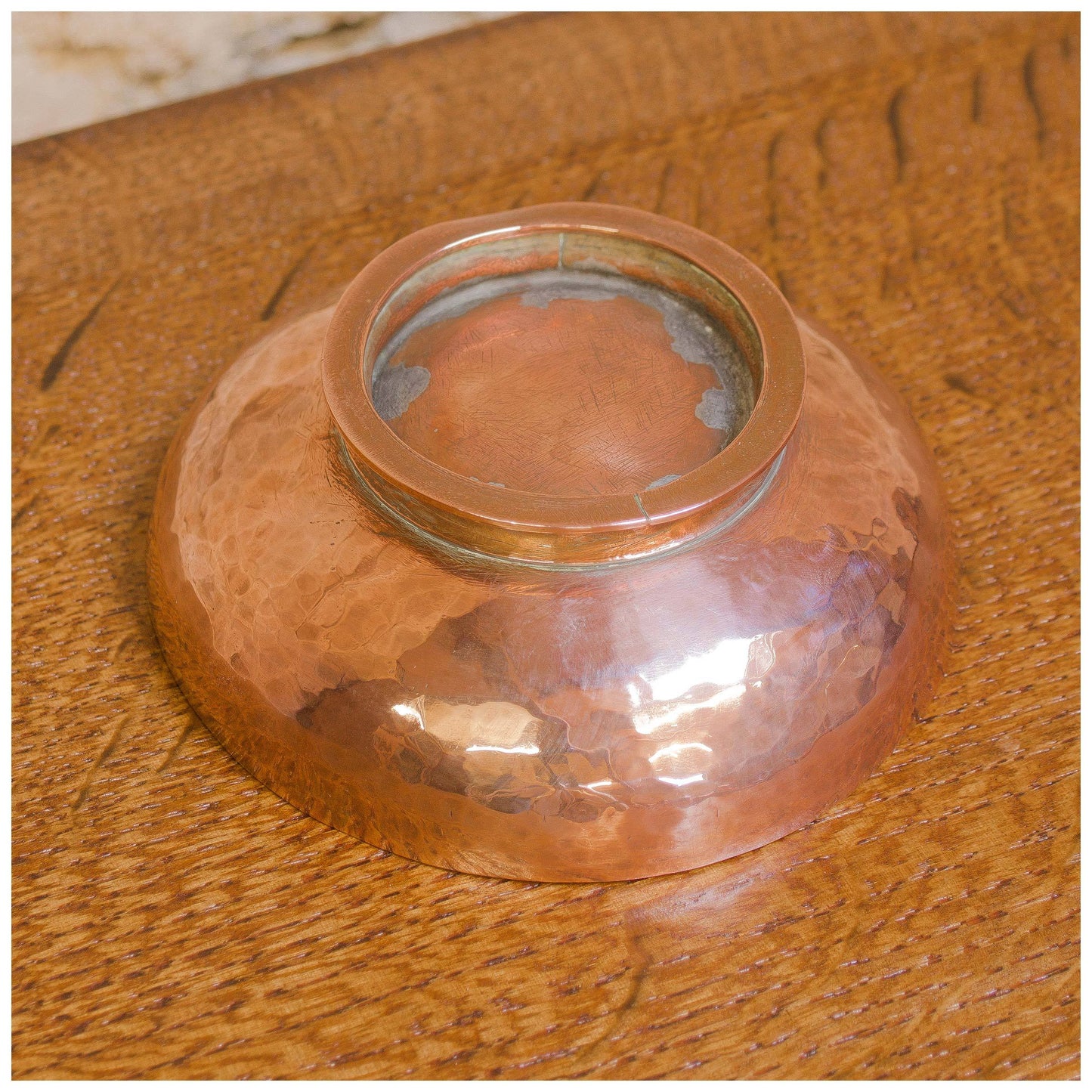 An Arts & Crafts Lakes School hand beaten copper bowl by Fanny Carter