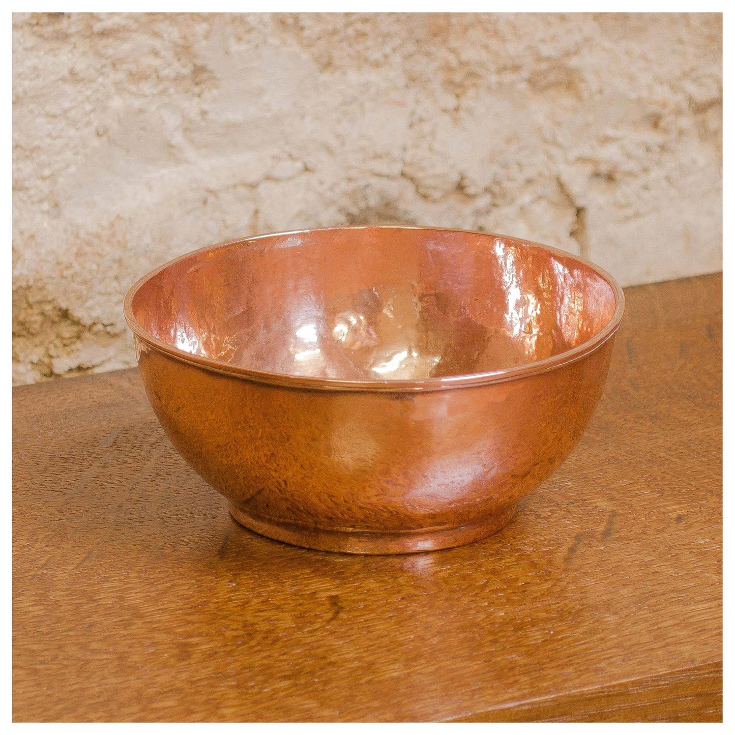 An Arts & Crafts Lakes School hand beaten copper bowl by Fanny Carter