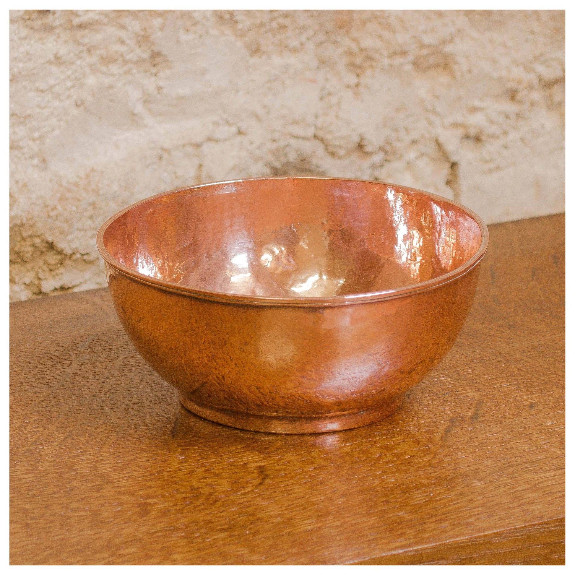 An Arts & Crafts Lakes School hand beaten copper bowl by Fanny Carter