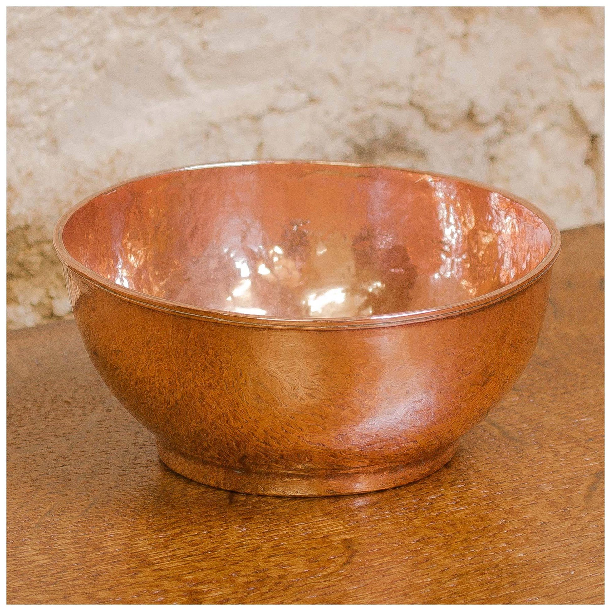 An Arts & Crafts Lakes School hand beaten copper bowl by Fanny Carter