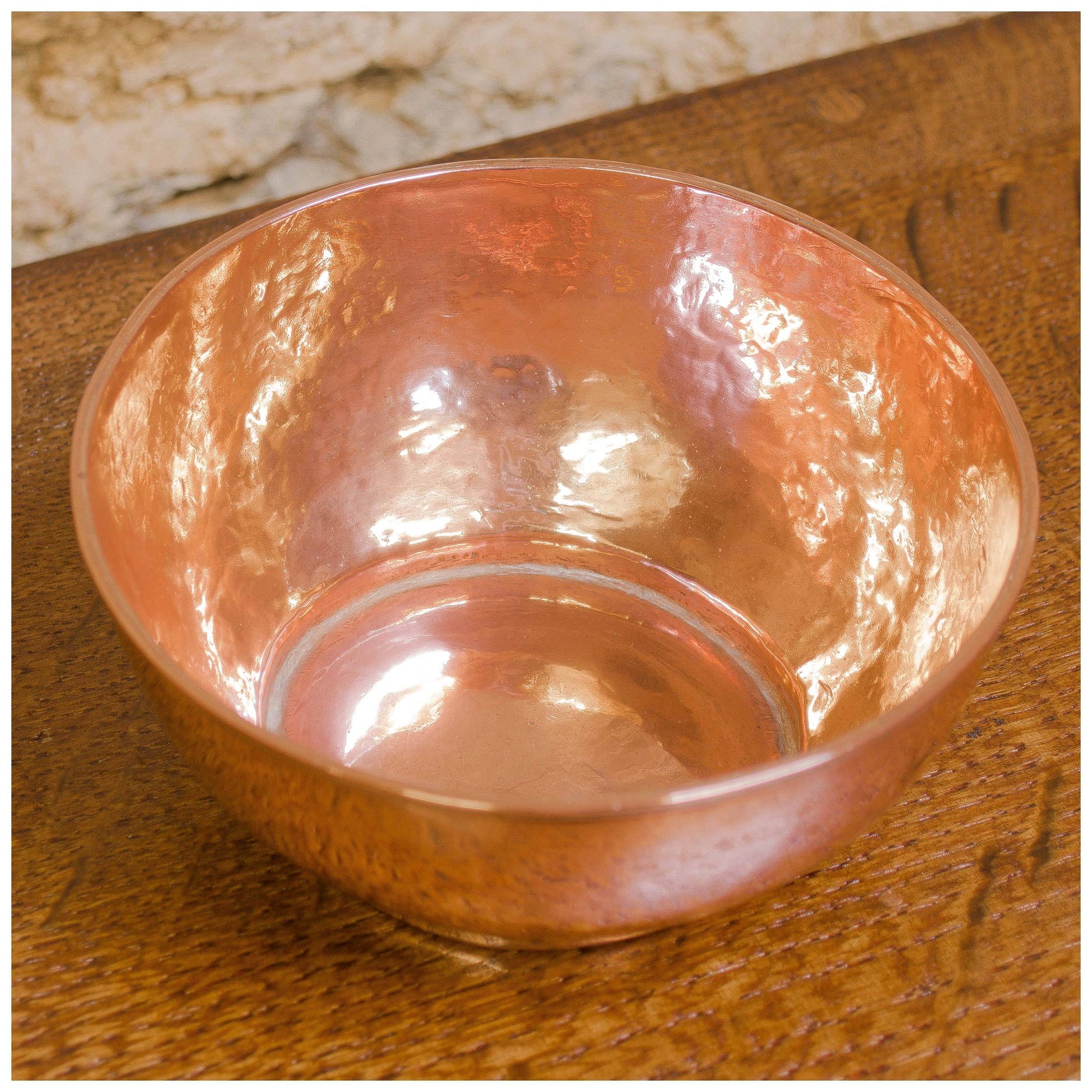 An Arts & Crafts Lakes School hand beaten copper bowl by Fanny Carter