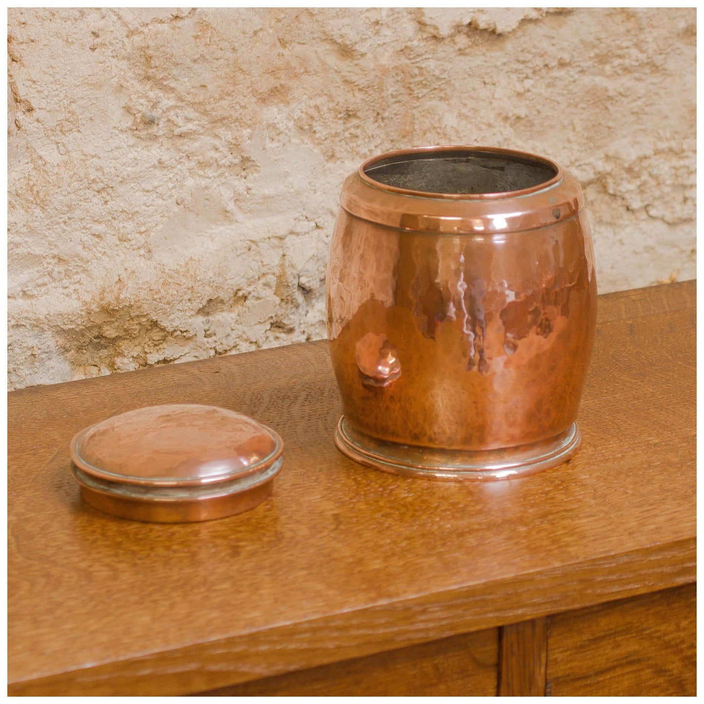 An Arts & Crafts Lakes School hand beaten copper jar by Fanny Carter