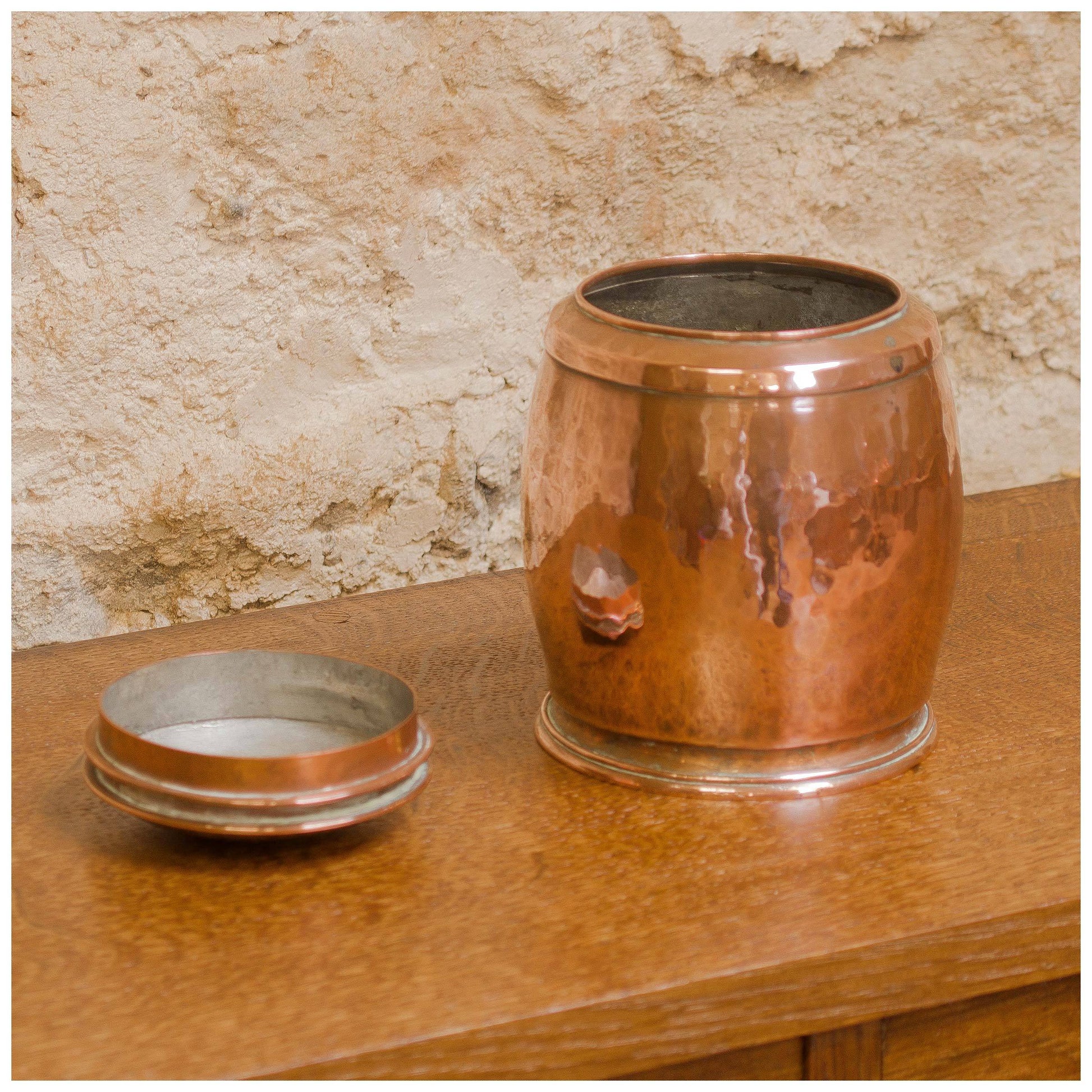 An Arts & Crafts Lakes School hand beaten copper jar by Fanny Carter