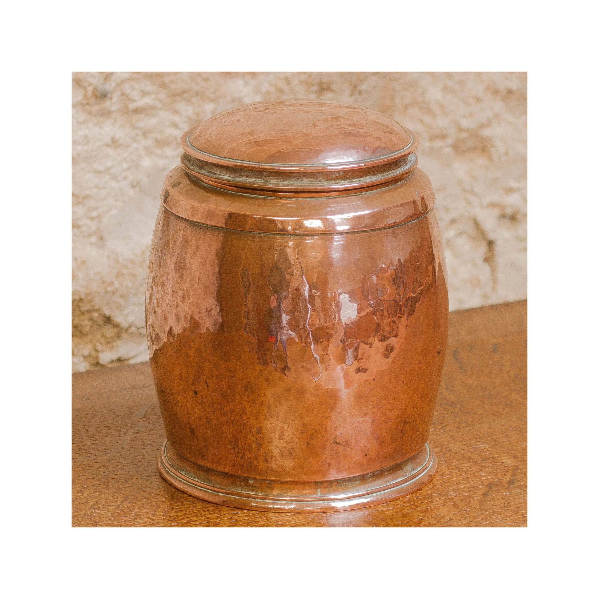 An Arts & Crafts Lakes School hand beaten copper jar by Fanny Carter